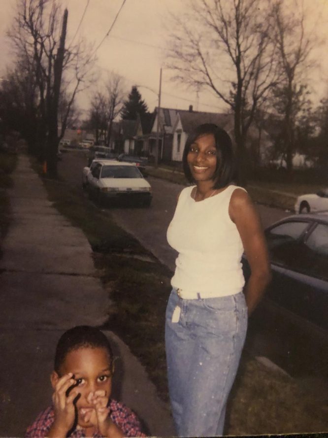 Young Ebop with his mom, E-Slim, on a Toledo sidewalk